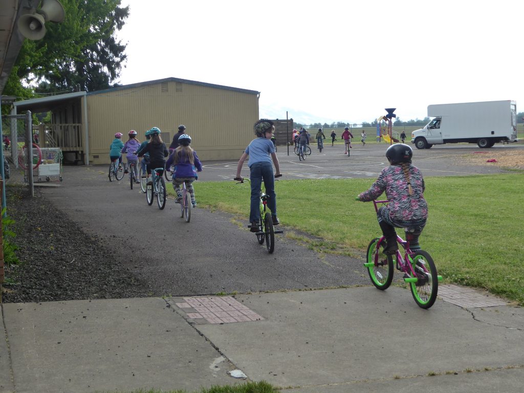 Kids riding bikes down the street